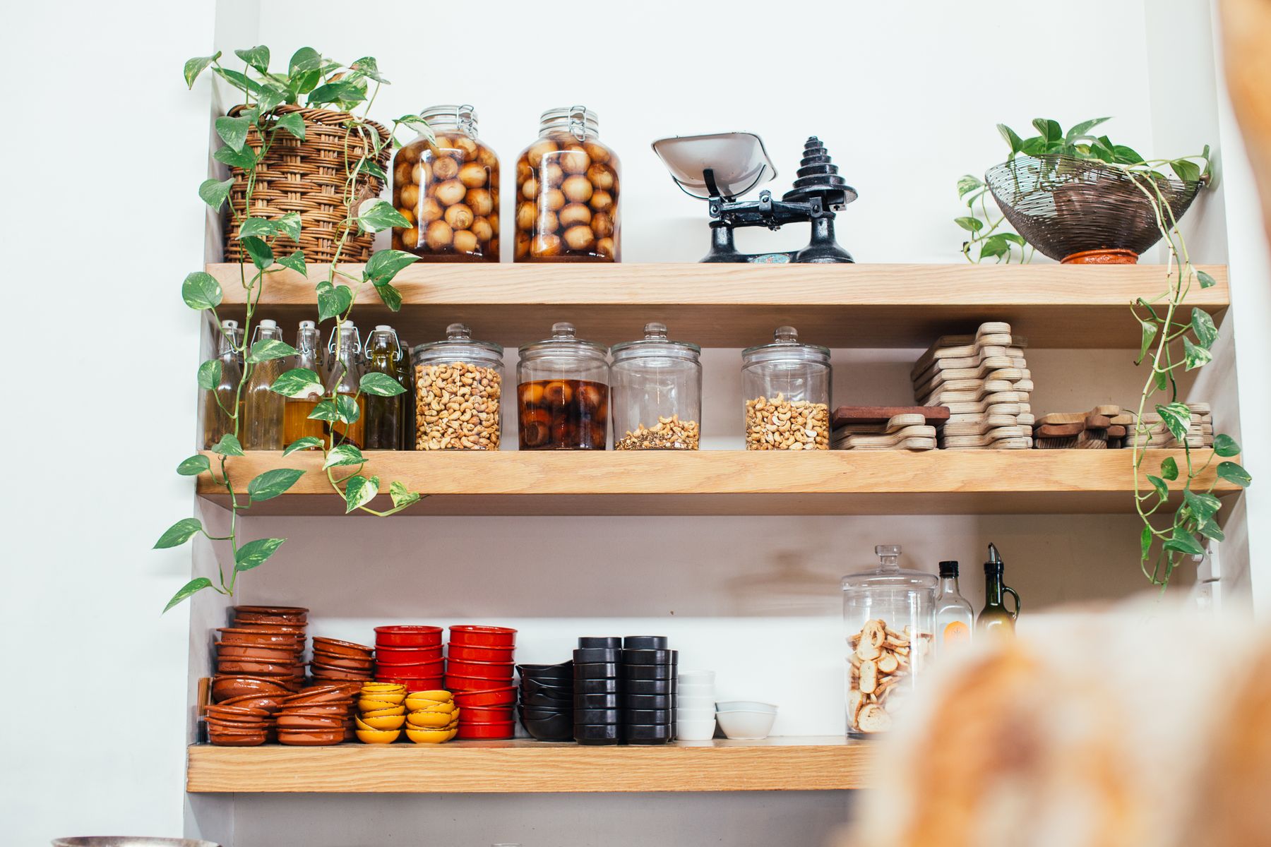 Shelves of glass storage jars, bowls and tableware